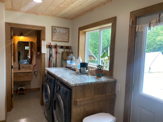 laundry area featuring a healthy amount of sunlight and independent washer and dryer