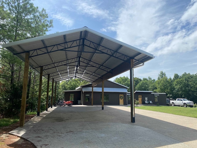 view of community with an outdoor structure and a yard