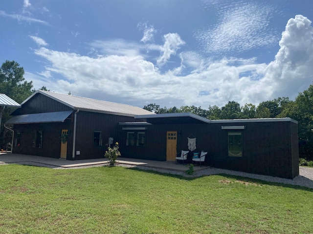 exterior space with a lawn and a patio area