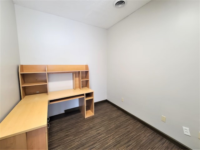 unfurnished office featuring dark wood-type flooring