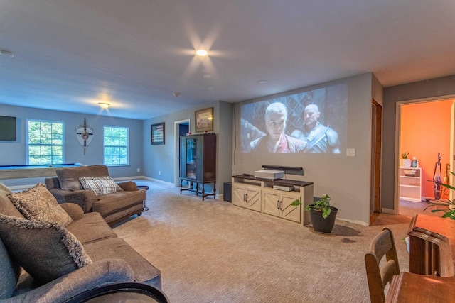 home theater featuring baseboards, pool table, and light colored carpet