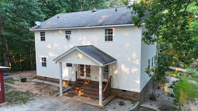 view of front of home with entry steps, crawl space, and roof with shingles