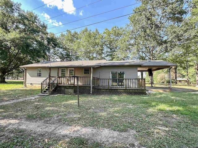 view of front facade with a wooden deck and a front lawn