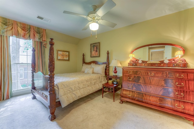 bedroom with a ceiling fan, carpet, and visible vents