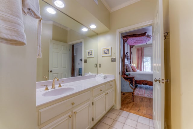 bathroom with tile patterned floors, recessed lighting, vanity, and ornamental molding