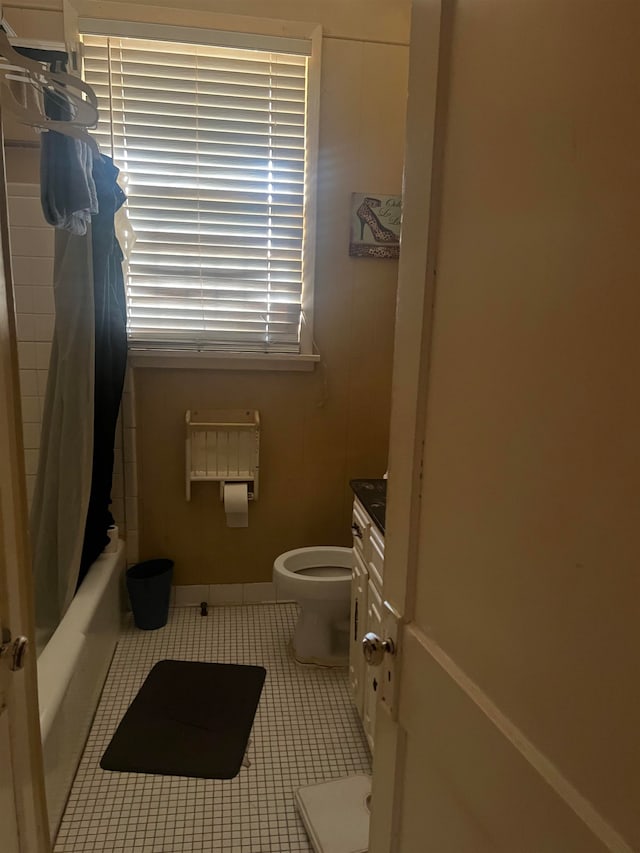 full bathroom featuring vanity, toilet, shower / tub combo with curtain, and tile patterned flooring