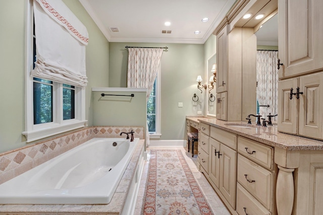 bathroom with a healthy amount of sunlight, crown molding, vanity, and tiled bath