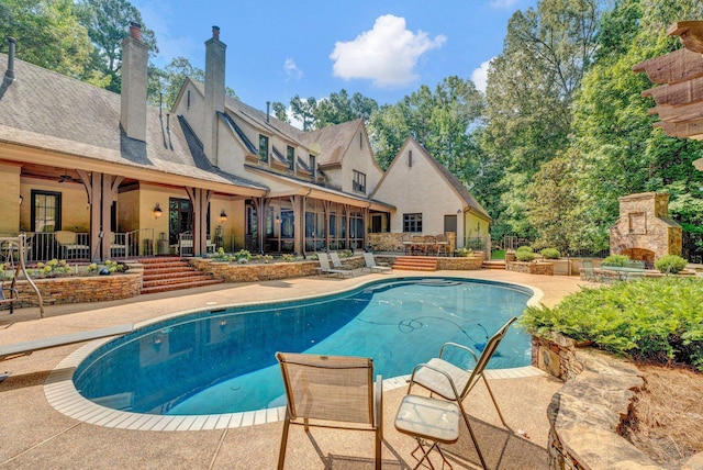 view of swimming pool with a patio