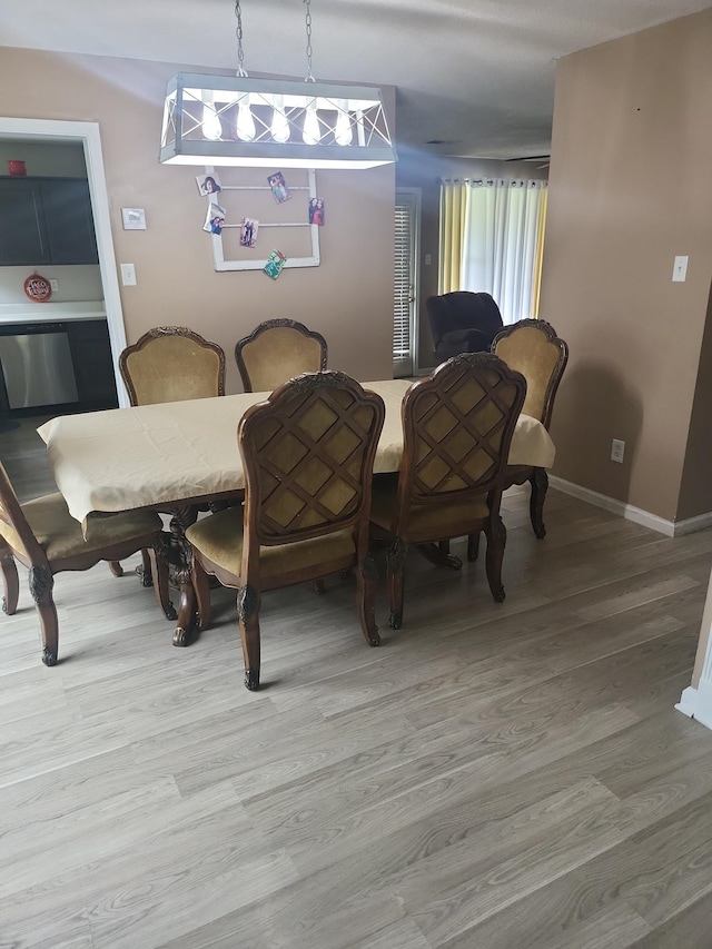 dining area with hardwood / wood-style flooring