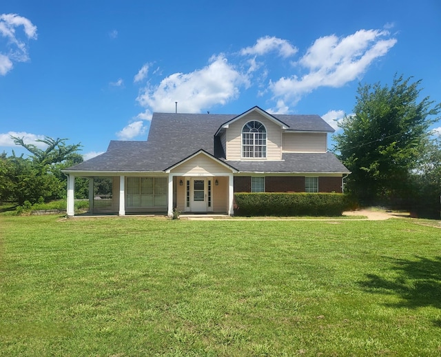 view of front of home with a front lawn and covered porch