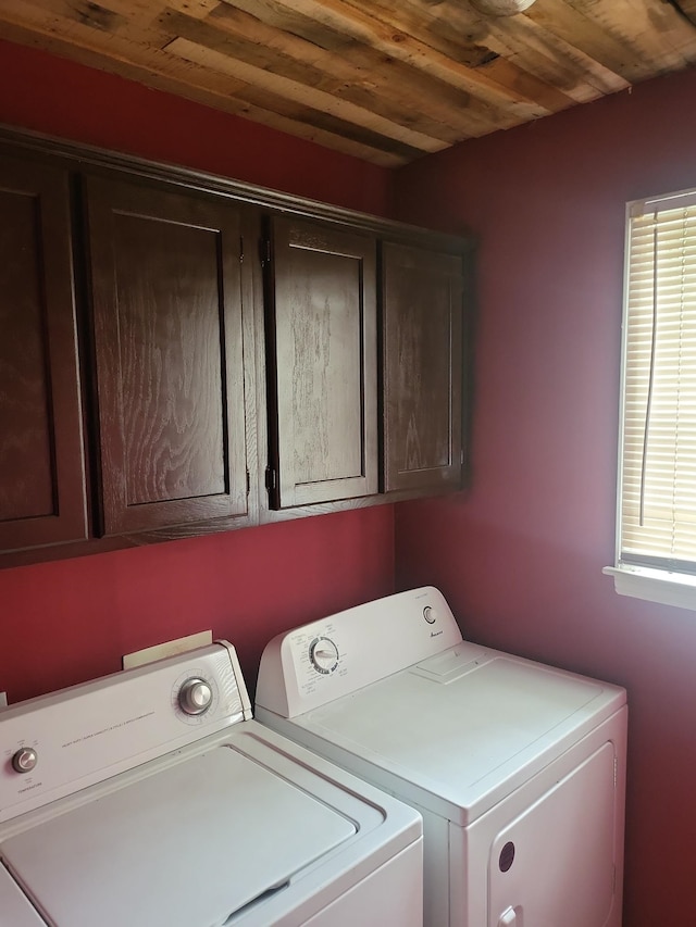 washroom with cabinets, separate washer and dryer, and wooden ceiling