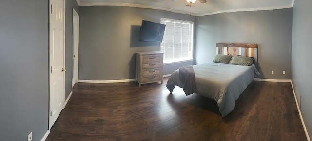 bedroom featuring ornamental molding, dark hardwood / wood-style floors, and ceiling fan