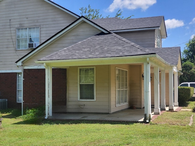 exterior space featuring a patio area and a lawn