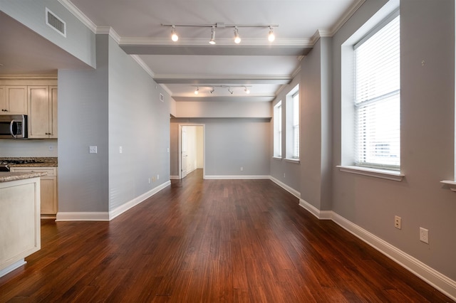 unfurnished living room featuring beamed ceiling, ornamental molding, and dark hardwood / wood-style flooring