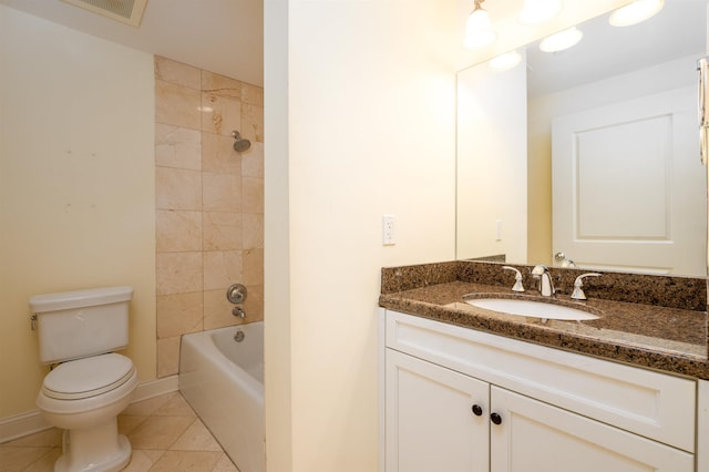 full bathroom with tile patterned flooring, vanity, toilet, and tiled shower / bath