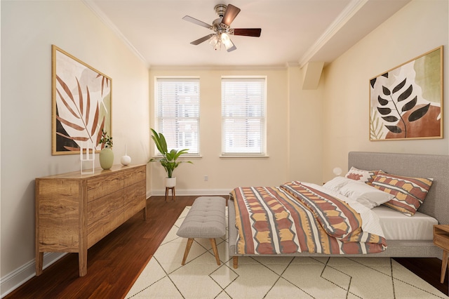 bedroom with ornamental molding, wood-type flooring, and ceiling fan