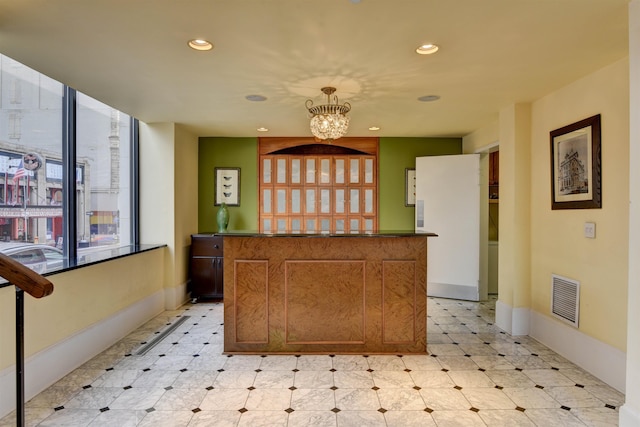 welcome area with a notable chandelier