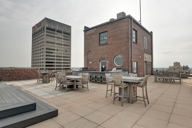 view of patio / terrace featuring an outdoor bar