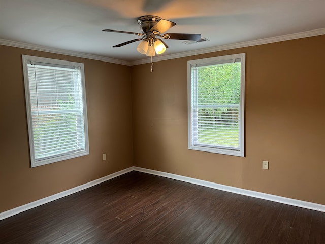 spare room featuring wood-type flooring, crown molding, and ceiling fan