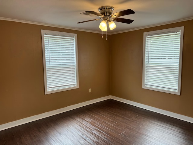 empty room featuring ceiling fan, hardwood / wood-style flooring, and ornamental molding