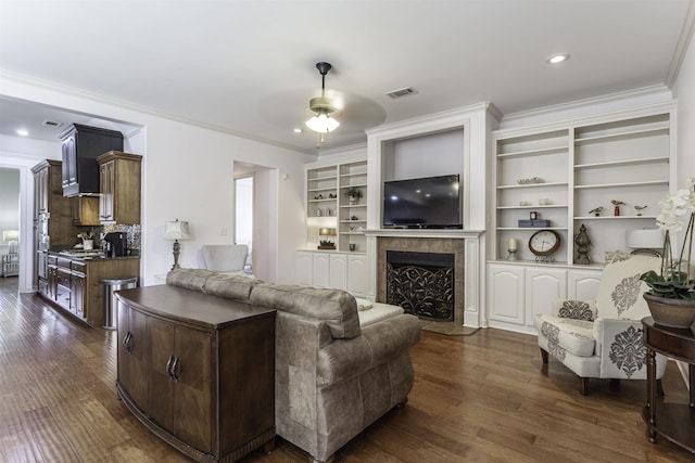 living room featuring crown molding, dark wood-type flooring, and ceiling fan