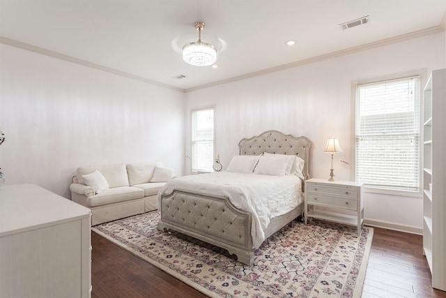 bedroom featuring ornamental molding, a chandelier, multiple windows, and dark hardwood / wood-style floors