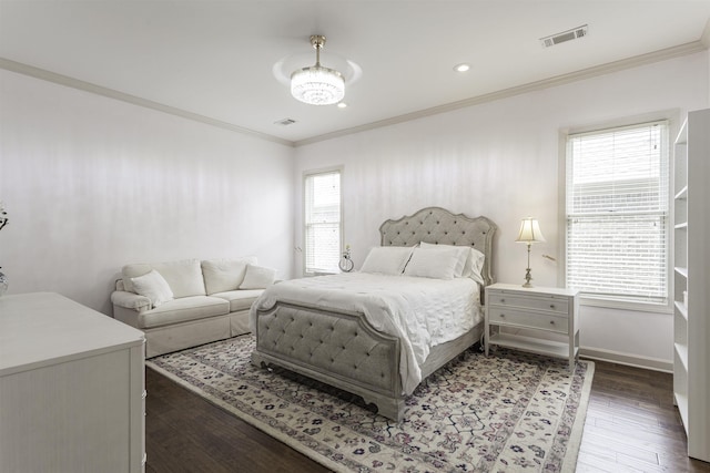 bedroom featuring crown molding and dark hardwood / wood-style flooring