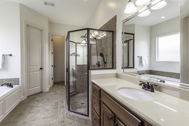 bathroom with tile patterned floors, plus walk in shower, vaulted ceiling, and vanity