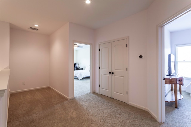 hallway featuring carpet floors