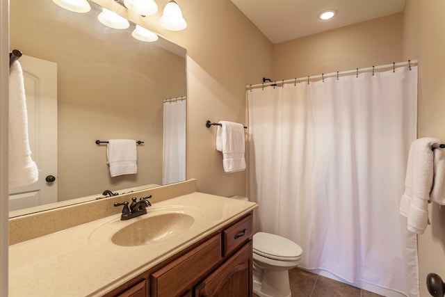 bathroom with vanity, toilet, a shower with shower curtain, and tile patterned floors