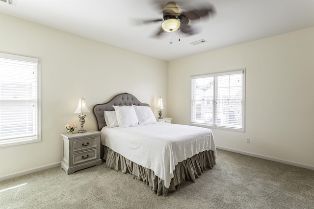 bedroom with light colored carpet and ceiling fan