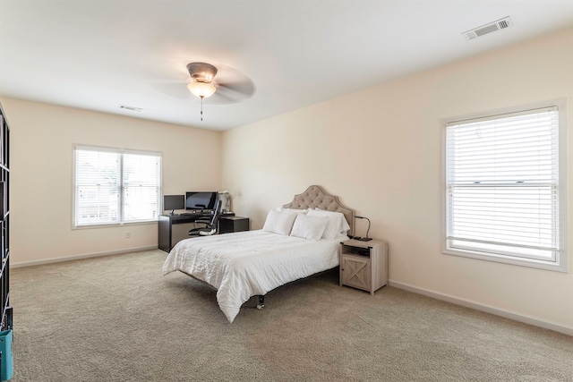 bedroom with ceiling fan and light colored carpet