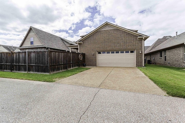 view of front of home featuring a garage and a front lawn