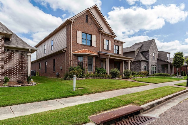 view of front facade featuring a front lawn and central air condition unit