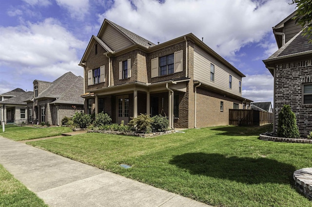 view of side of home with a lawn