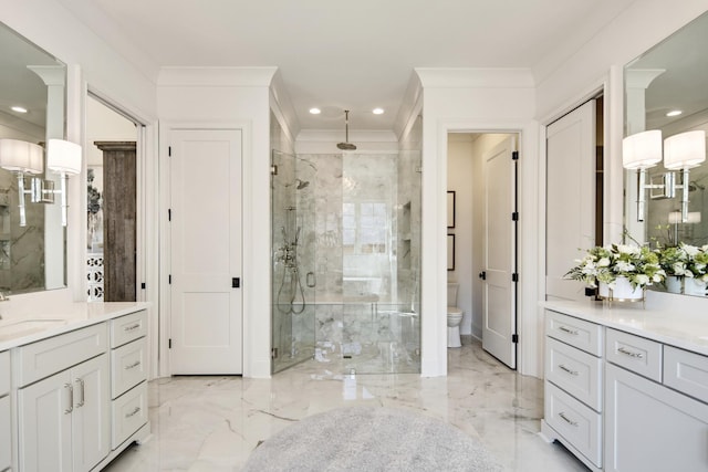 bathroom with a shower with door, ornamental molding, vanity, and toilet