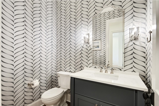 bathroom with vanity and toilet