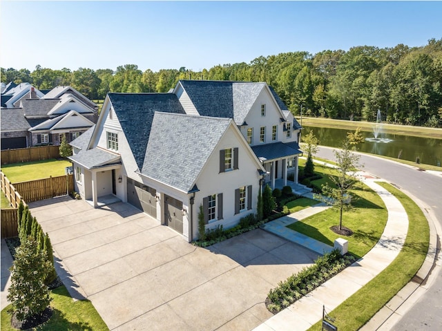 birds eye view of property featuring a water view