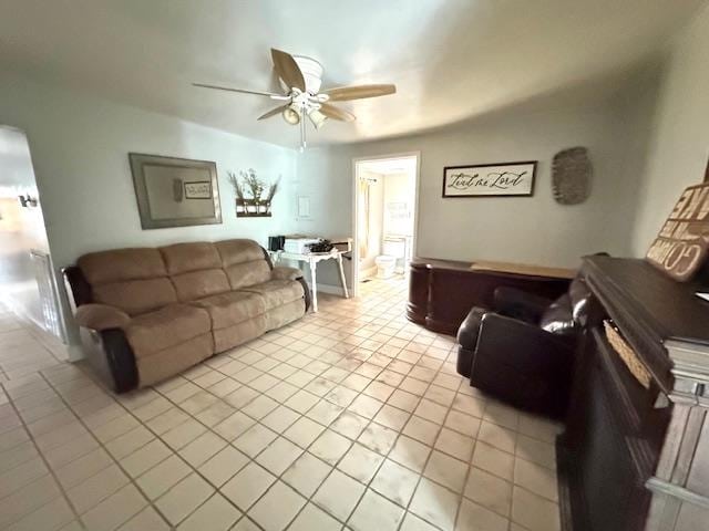 tiled living room featuring ceiling fan