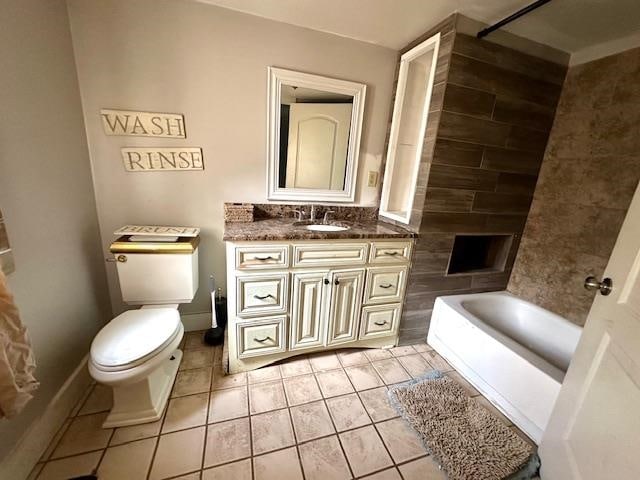 bathroom with tile patterned floors, vanity, and toilet