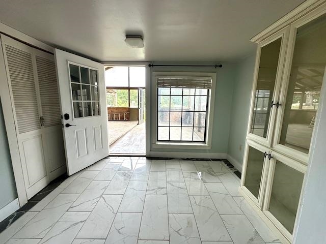 entryway with light tile patterned floors