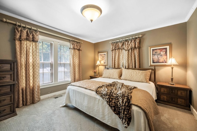 bedroom with light colored carpet, crown molding, visible vents, and baseboards