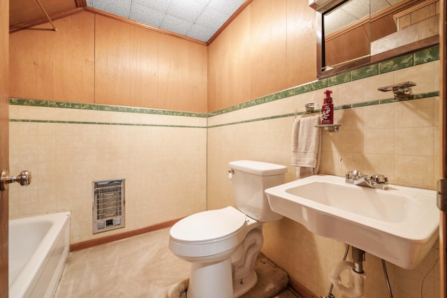 bathroom featuring tile walls and toilet