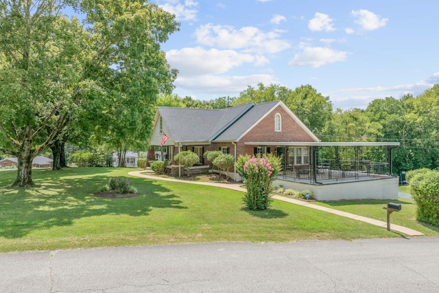 view of front facade with a front lawn and brick siding