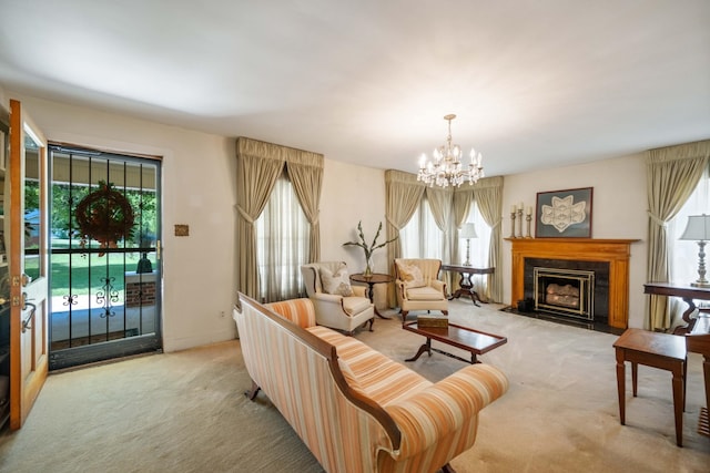 living room featuring a premium fireplace, a water view, light colored carpet, and a chandelier