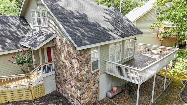 view of property exterior featuring a deck