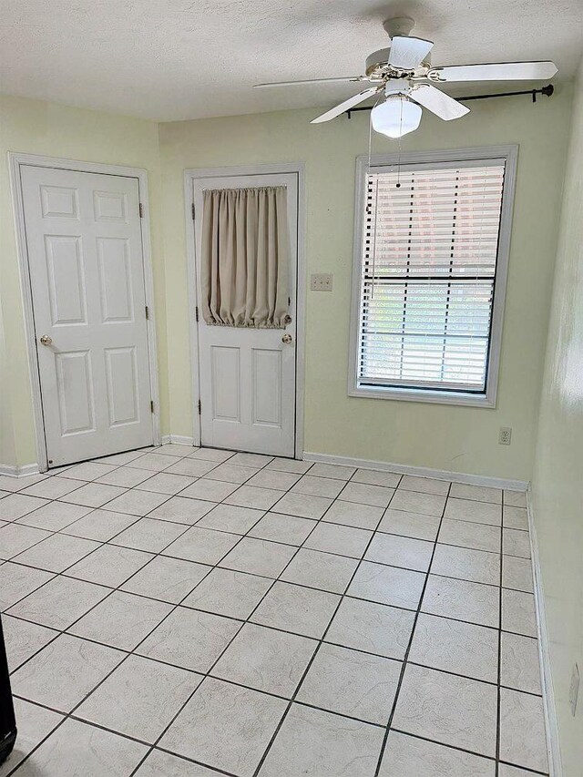 full bathroom featuring tile patterned flooring, vanity, and tiled shower / bath combo