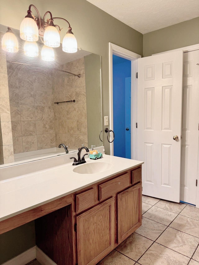 bathroom with vanity and a textured ceiling