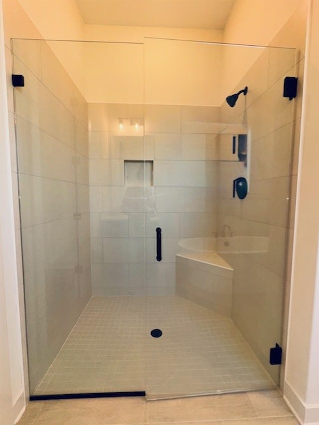 bathroom with a shower stall