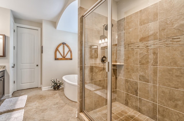 bathroom featuring tile patterned floors, vanity, and independent shower and bath